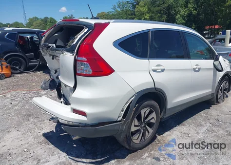 2015 Honda Cr-V Touring z USA, uszkodzony, nr VIN 5J6RM3H96FL023865